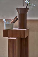 Closeup view at brown wood stand with objects