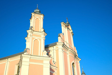Beautiful bright old church on a background of blue sky.