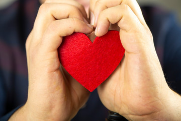 Fototapeta premium Hand holding Red Heart, Love and Donation Concept