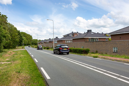 Cars driving on the Carolus Clusiuslaan (N443) in the direction of  the village of Sassenheim in The netherlands.