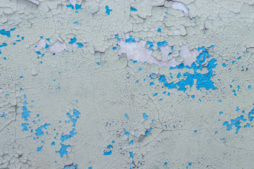 Old painted wall with cracked paint