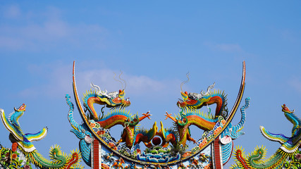 bright multi-colored sculptures of Japanese samurai dragons on the roof of traditional temples....