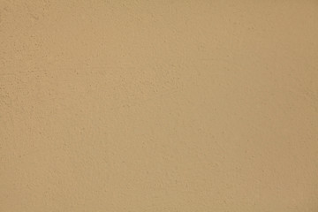 Beige or light-brown wall, texture, background. The building wall, painted with water-based paint....