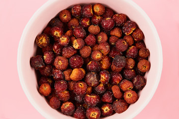 dried fruits, orange peels, rose hip, on a bright background