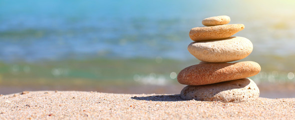 stack of stones on sand
