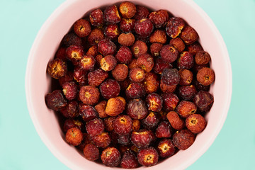 dried fruits, orange peels, rose hip, on a bright background