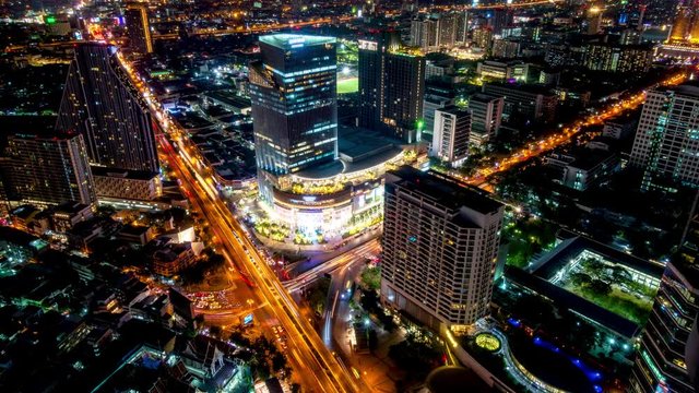 Bangkok business district city center above Samyan area and traffic, with buildings and skyscrapers, during night – Time Lapse