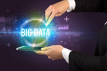 Close-up of a touchscreen with BIG DATA inscription, new technology concept