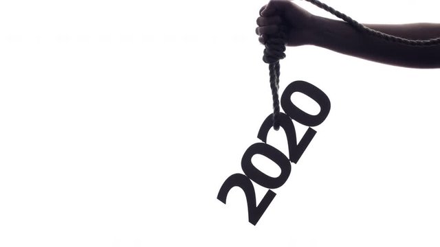 silhouette of a male hand with a rope loop with numbers on a white isolated background, concept financial collaps, economic crisis in 2020 year