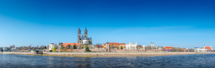 Fototapeta na wymiar Panoramic view over downtown of Magdeburg, old town, Elbe river and Magnificent Cathedral at early Spring, Germany, at sunny day and blue sky, wide angle