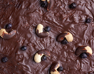 texture of baked brownie chocolate cake with chocolate poured. Cooked homemade food. Chocolate pastry