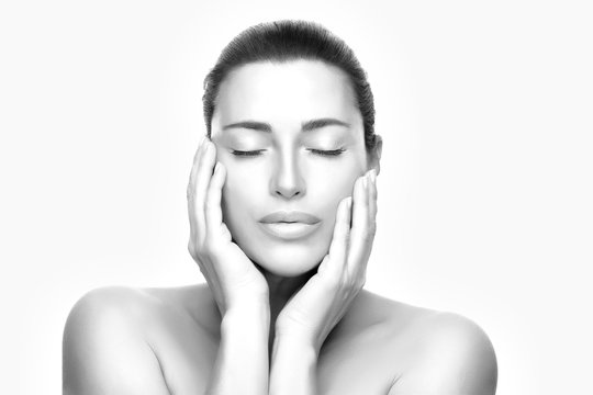 Beauty woman face with clean fresh skin. Spa, Wellness and Skincare. Black and white portrait
