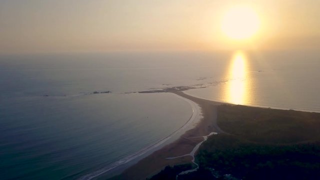 Aerial Drone View of the Beach Whale's Tail during sunset at the Marino Ballena National Park in Uvita, Costa Rica