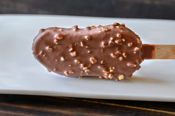 Chocolate-covered vanilla ice cream bar