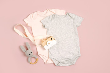 Cute baby bodysuits with toys. Set of kids clothes and accessories. Fashion newborn. Flat lay, top...