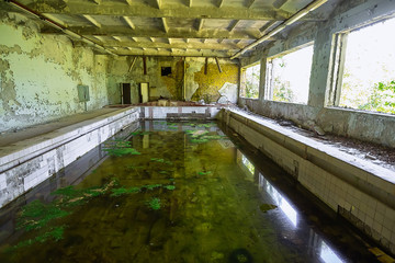 Abandoned school swimming pool in ghost town Pripyat Chornobyl Zone