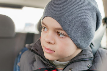 Portrait of a boy in a car