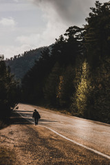 A homeless man walking alone on the road in Turkey