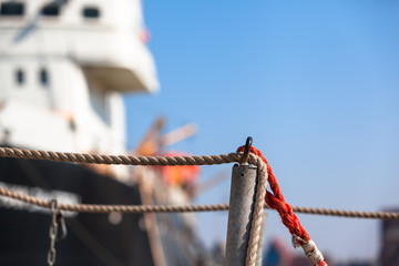 Sea Travel Scene Close-Up / Detail of nostalgic ship at berth and gangway rope (copy space)