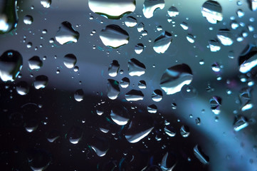 Drops of water on a glass, macro, selective focus.
