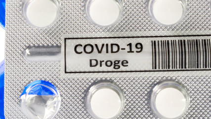 The white drug Covid-19 Droge written in German in the tablet pack for coronavirus