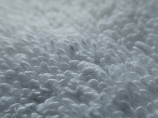 Close up macro photo with great detail of luxurious garment of 5 star hotel white cotton towel