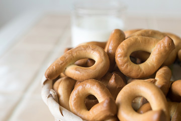 Dried bagels in a basket on the table.