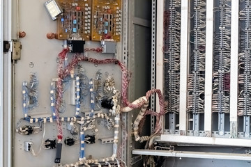 Chip boards and electronic components. Control cabinet, view from the inside. Close-up.