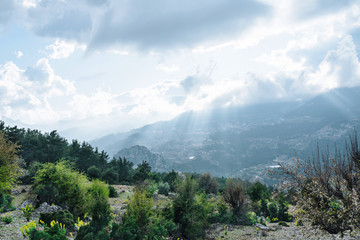  Highlands with mountains and clouds with sunlight and green forest