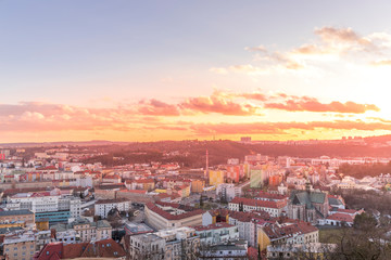 Obraz premium Day to night time-lapse when Brno city square and surroved area goes from sunset when sunshine change city colors to orange through sunset to night when city light goes on captured 4k high resolution