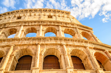 Naklejka premium Italian spring walks. The spring sun illuminating the coliseum in Rome.