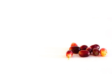 Red grapes separated and photographed against white background with space for content