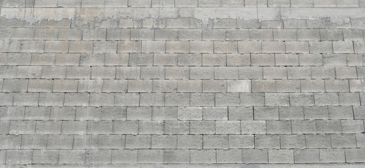 Brick wall of gray blocks