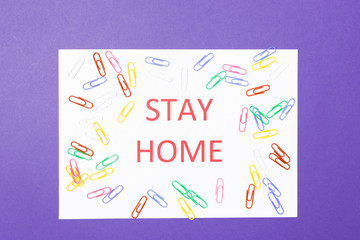 Words stay at home on purple background. Pandemic Protection Concept. Minimal concept. Stay safe, concept of self quarantine at home as preventative measure against virus outbreak. Social Distancing 