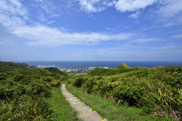 Fototapeta na wymiar High angle shot of the sea and mountain landscape in New Taipei City Taiwan