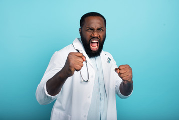 Brave medic fight against covid-19 coronavirus. Blue background