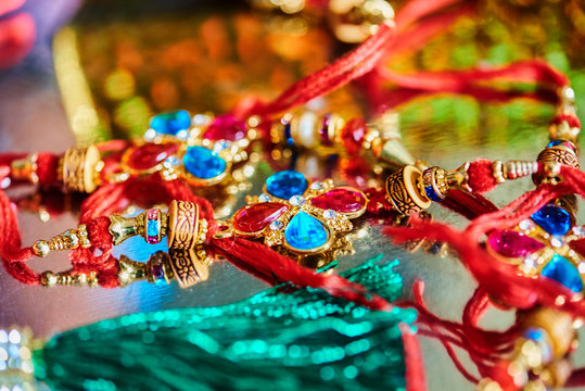 Close-up Of Multi Colored Rakhis On Table