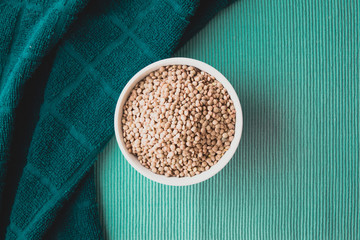 Bowl of lentils on a green ground