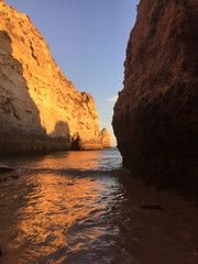 sea ​ between rocks at sunset