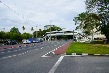 Road marks, sidewalk, overpass and different trees of Bandar Seri Begawan, Brunei. November 2019
