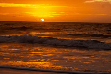 Obraz na płótnie Canvas Burning Ocean Sunrise on the Beach