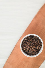 Bowl of coffee on a table and white ground