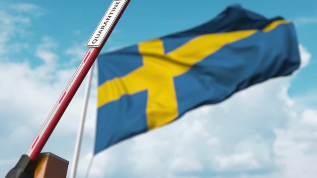 Opening boom barrier with QUARANTINE sign against the Swedish flag. Unrestricted entry in Sweden
