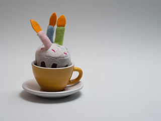 yellow coffee cup with birthday cake