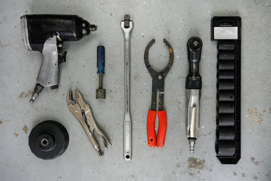 Assorted mechanic tool isolated on concrete background. 
