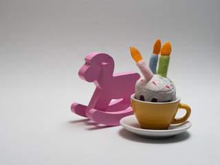 wooden pink horse rocker on white background