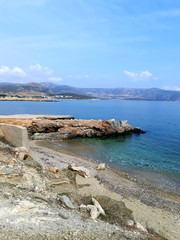 Beautiful stony coast in Naxos at sunset light