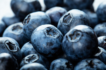 Fresh blueberry background. Texture blueberry berries close up. Vegan and vegetarian concept.
