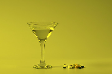 Summer coctail. Pills and glass of water.