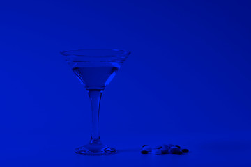 Summer coctail. Glass of water and medicin.